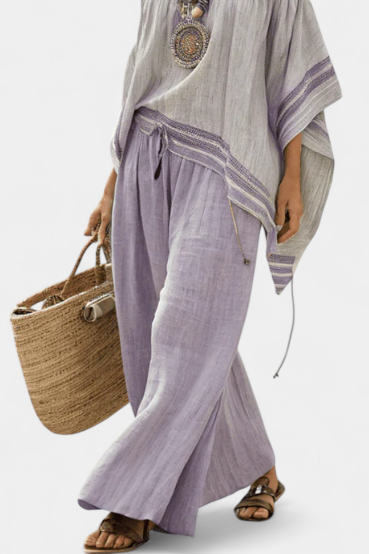 Zandrel | Conjunto de elegante top con hombros descubiertos y pantalones anchos a rayas